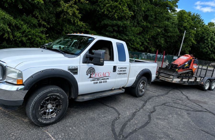 Legacy crew maintaining a residential lawn